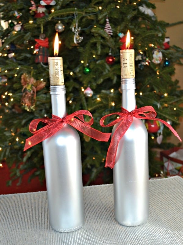 candle wine bottles under a Christmas tree