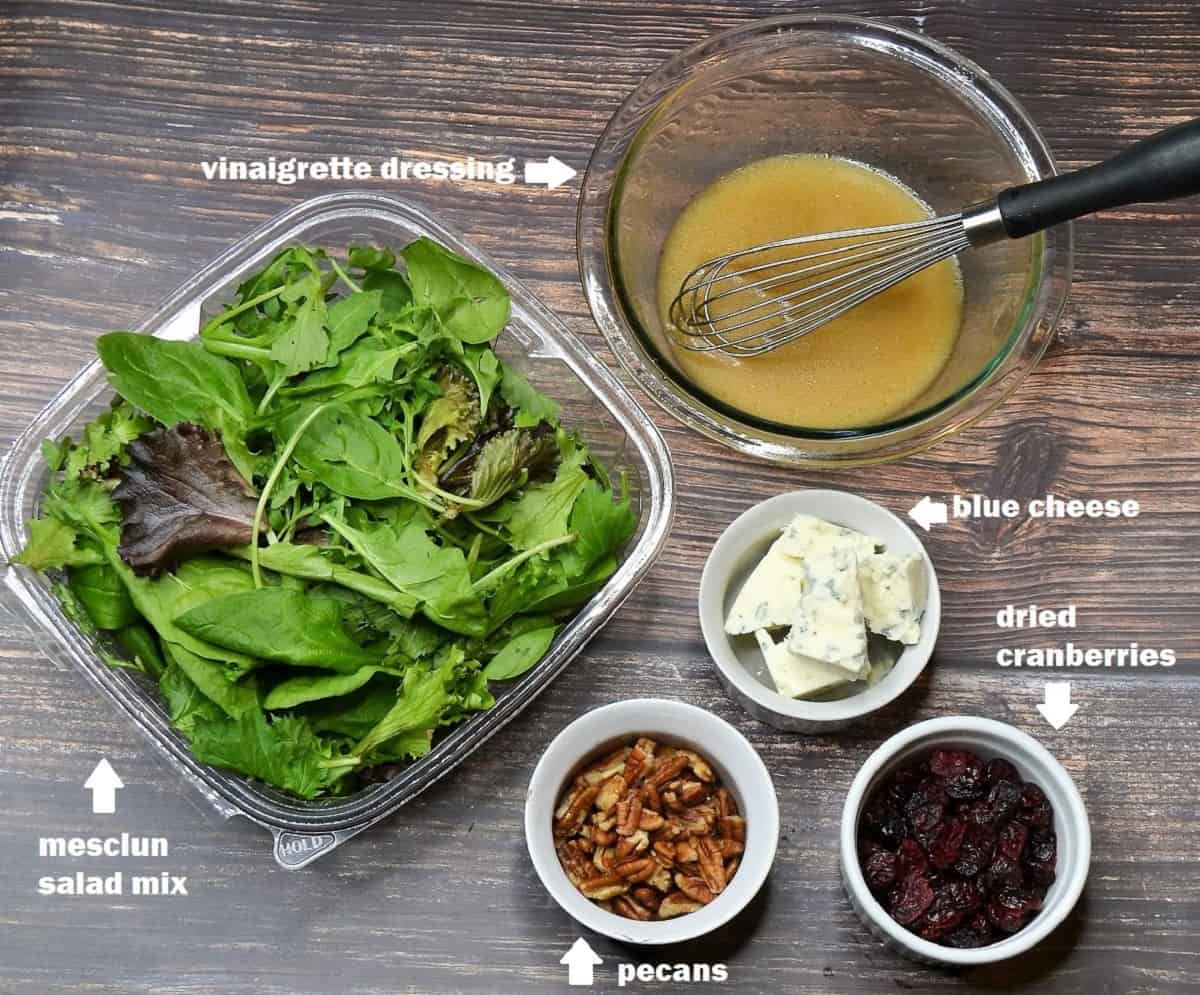 ingredients: Mesclun spring salad mix, dressing, pecans, blue cheese and dried cranberries