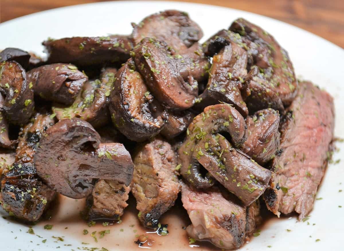 Plump delicious mushrooms over steak  