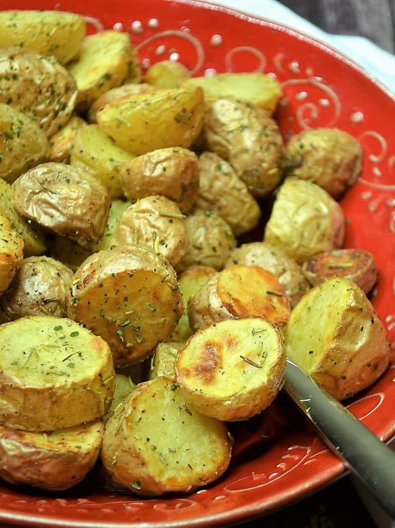 Roasted potatoes on a plate to serve with scallops. 