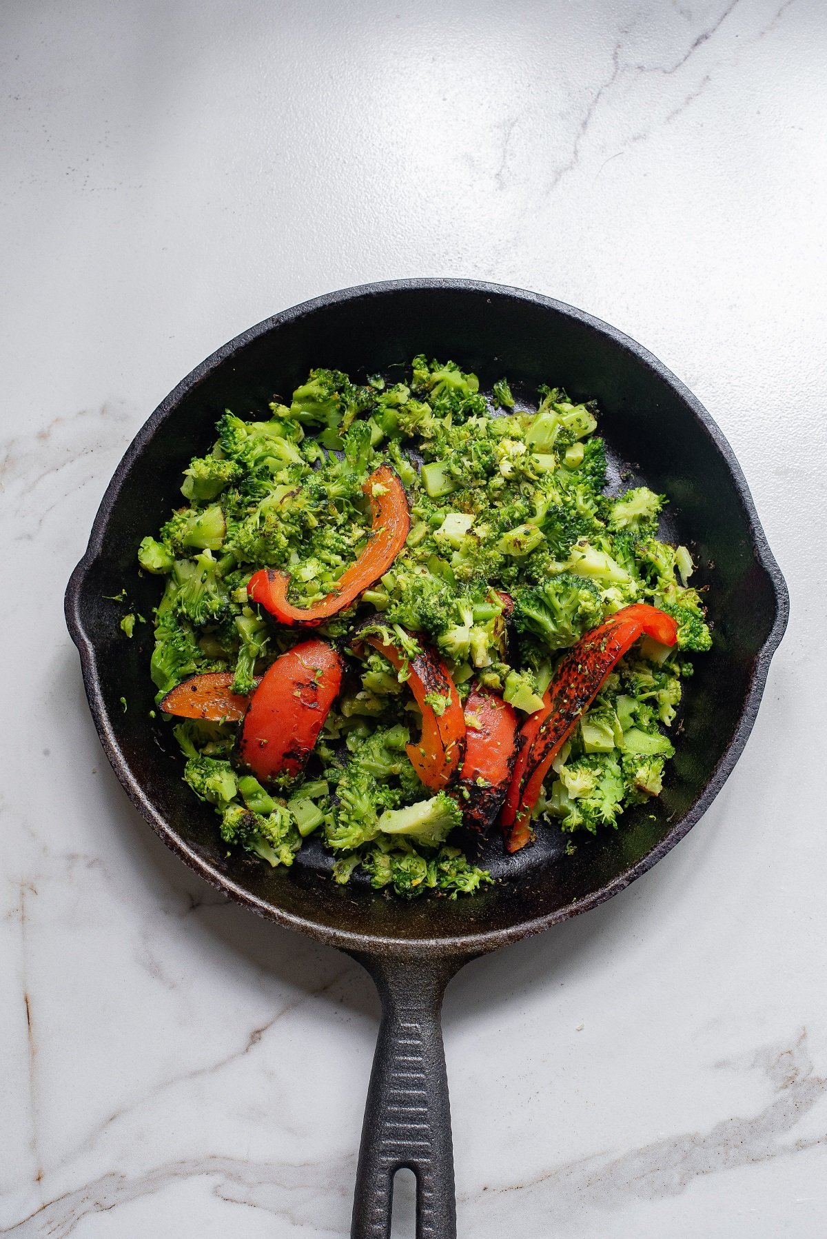 Saute the vegetables for the quiche.