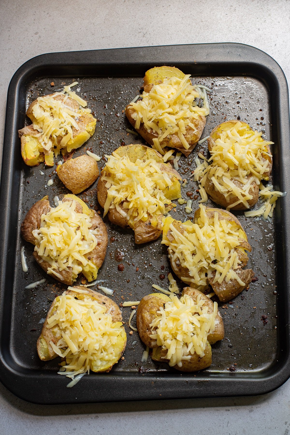 Crispy potatoes are topped with cheese. 