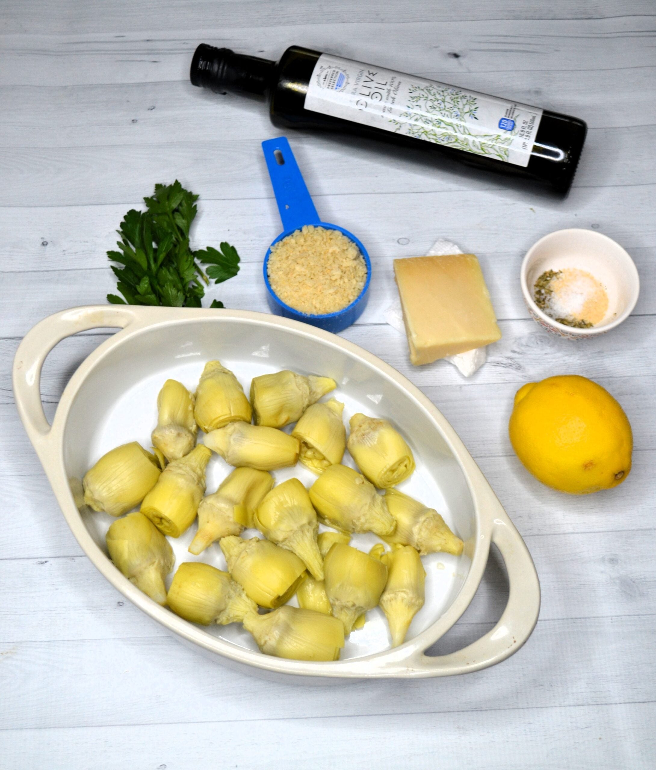 Ingredients needed for baked artichoke hearts. 
