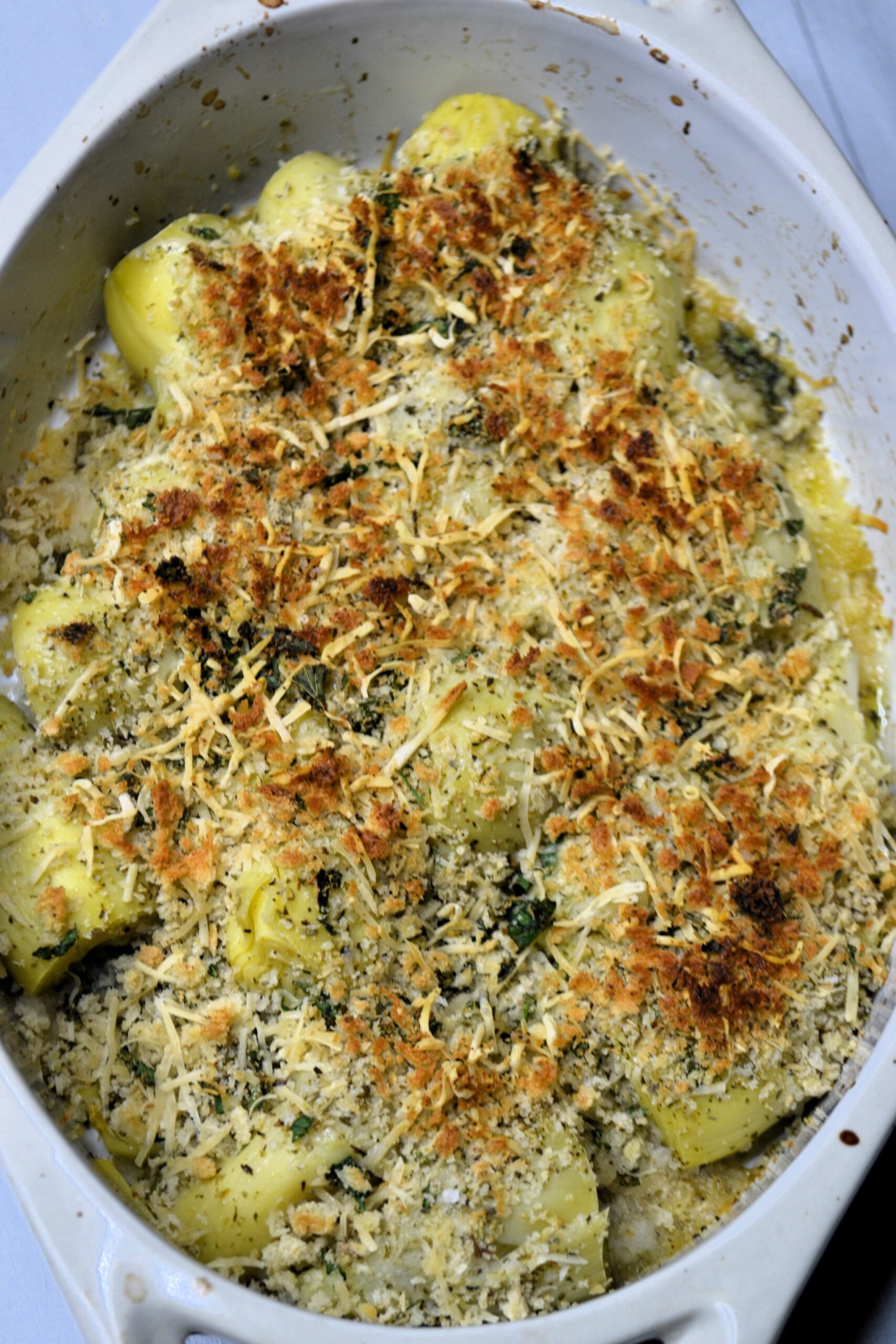 Baked artichoke hearts in a dish. 