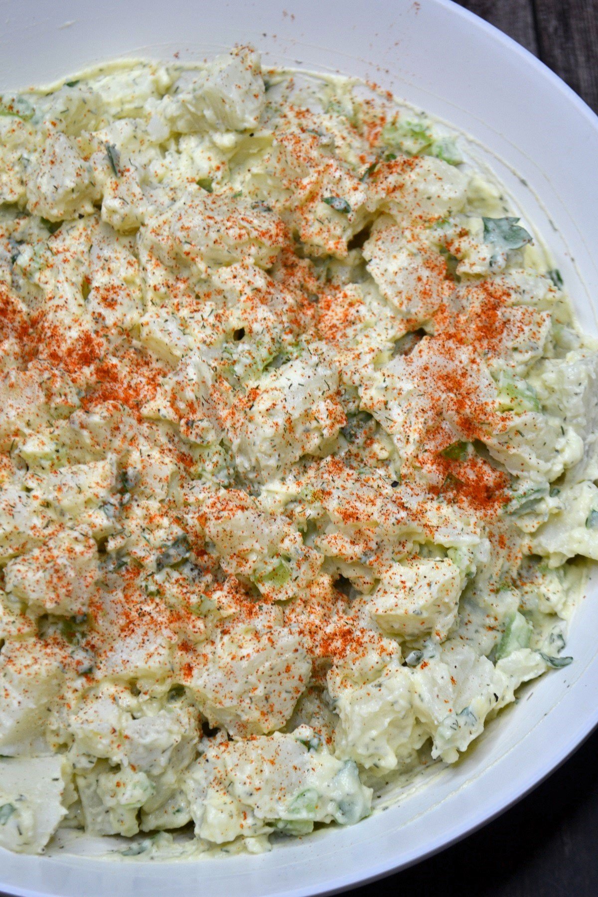 A bowl of simple potato salad without eggs.