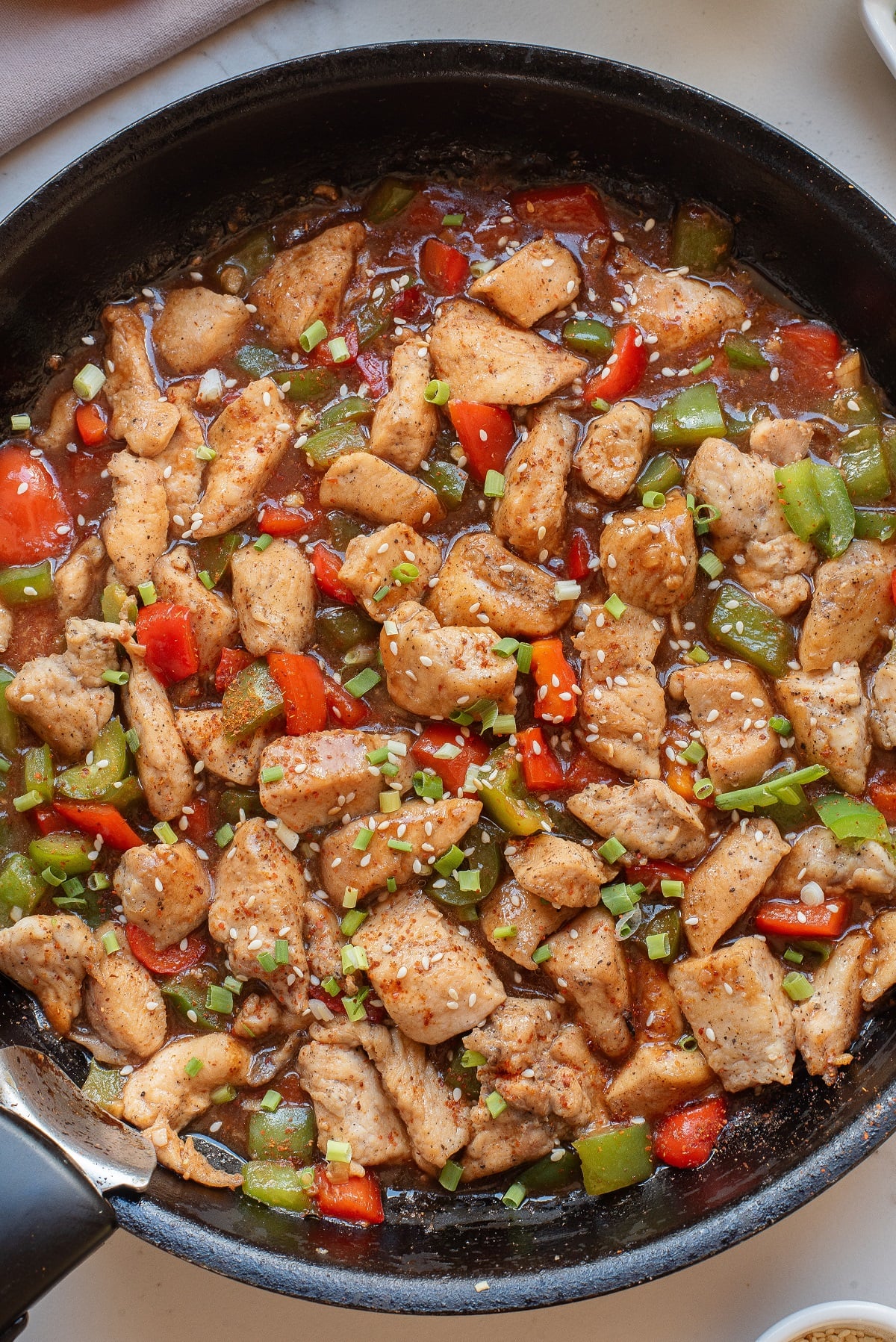 A skillet with Hunan chicken recipe. 