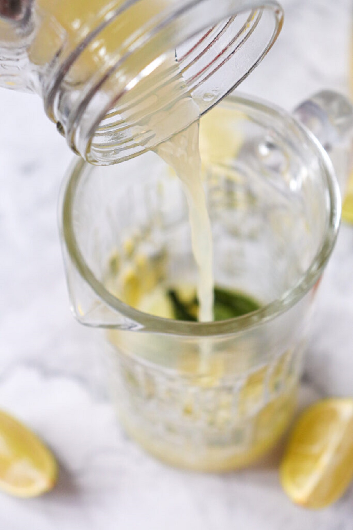 Nojito ingredients are combined in a glass pitcher. 
