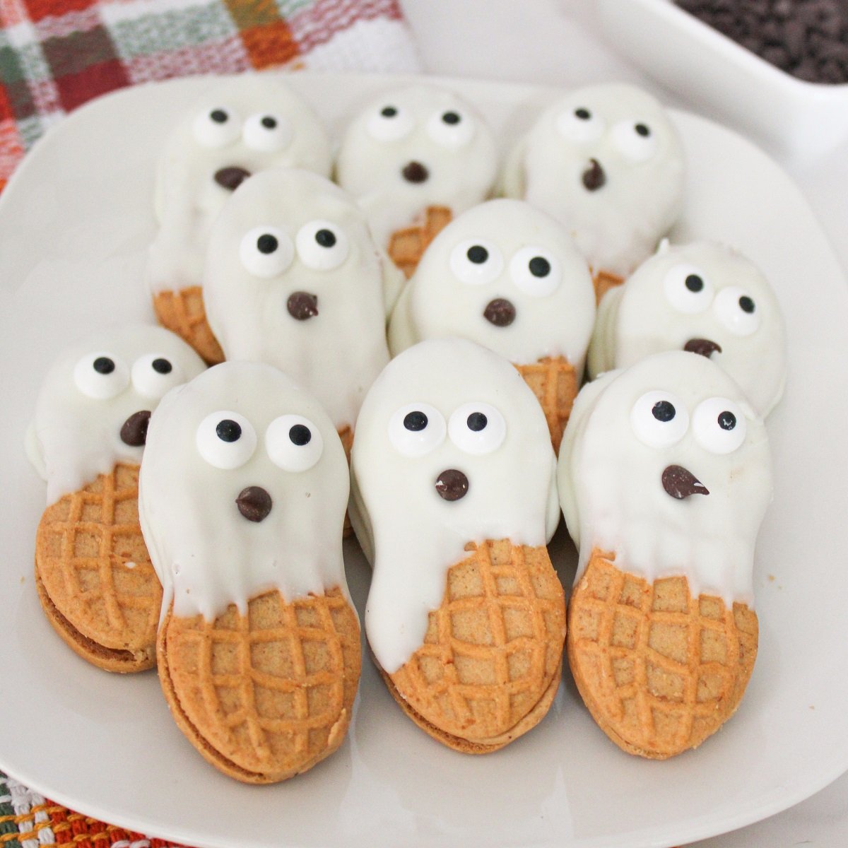 Peanut butter cookies dipped in white chocolate to look like ghosts. 