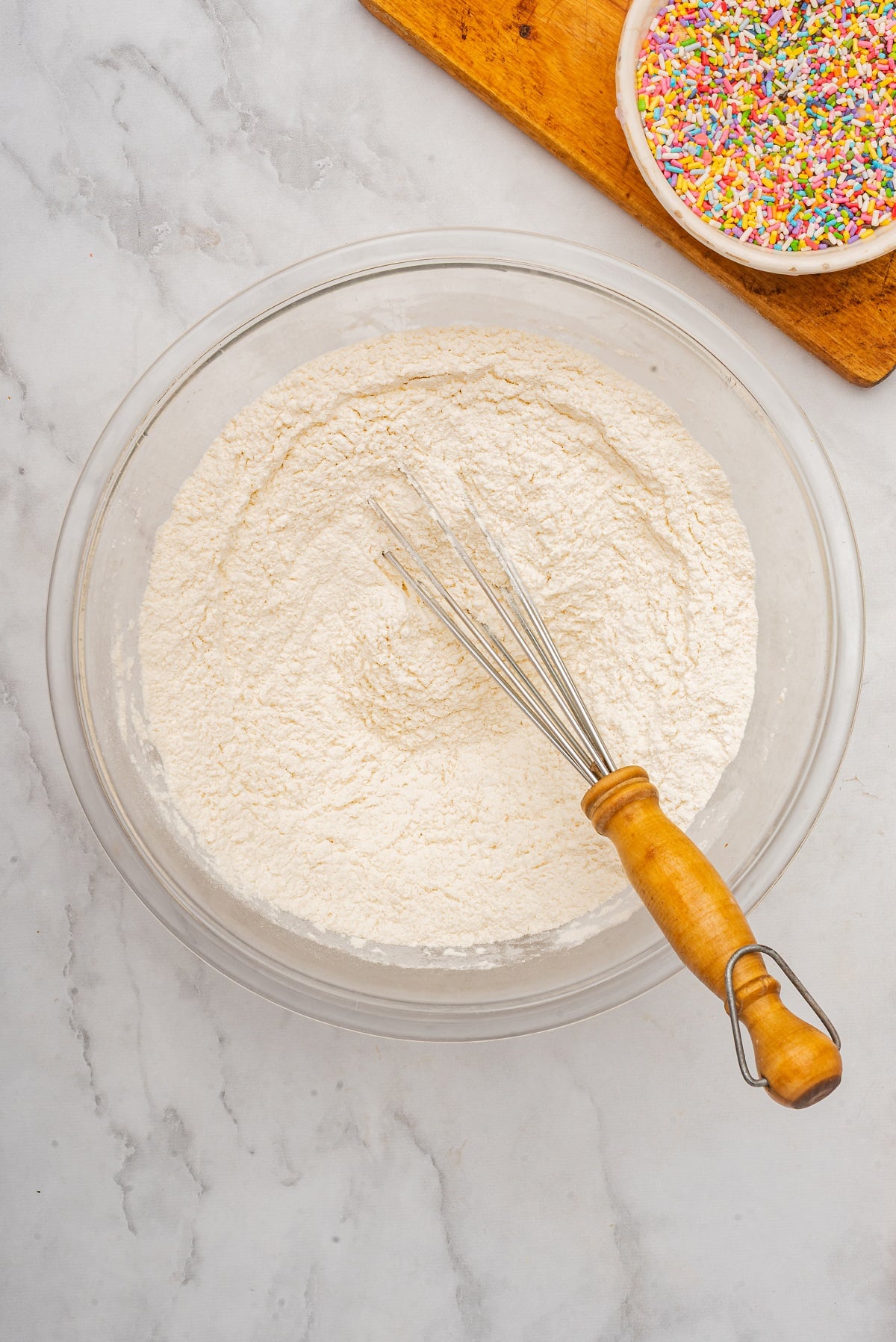 Dry pancake ingredients are mixed in a bowl. 