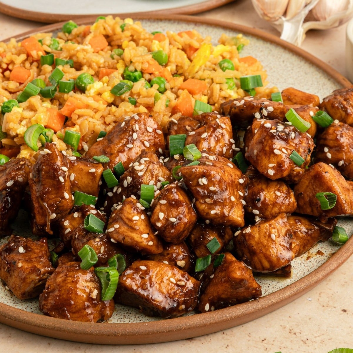A plate of hibachi chicken and fried rice. 