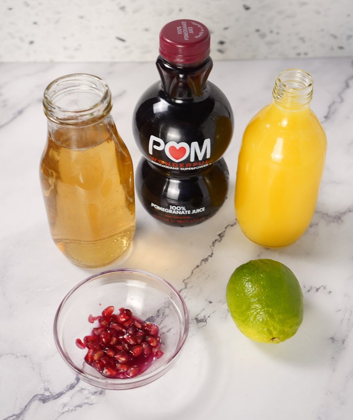 Ingredients needed to make pomegranate mocktail. 