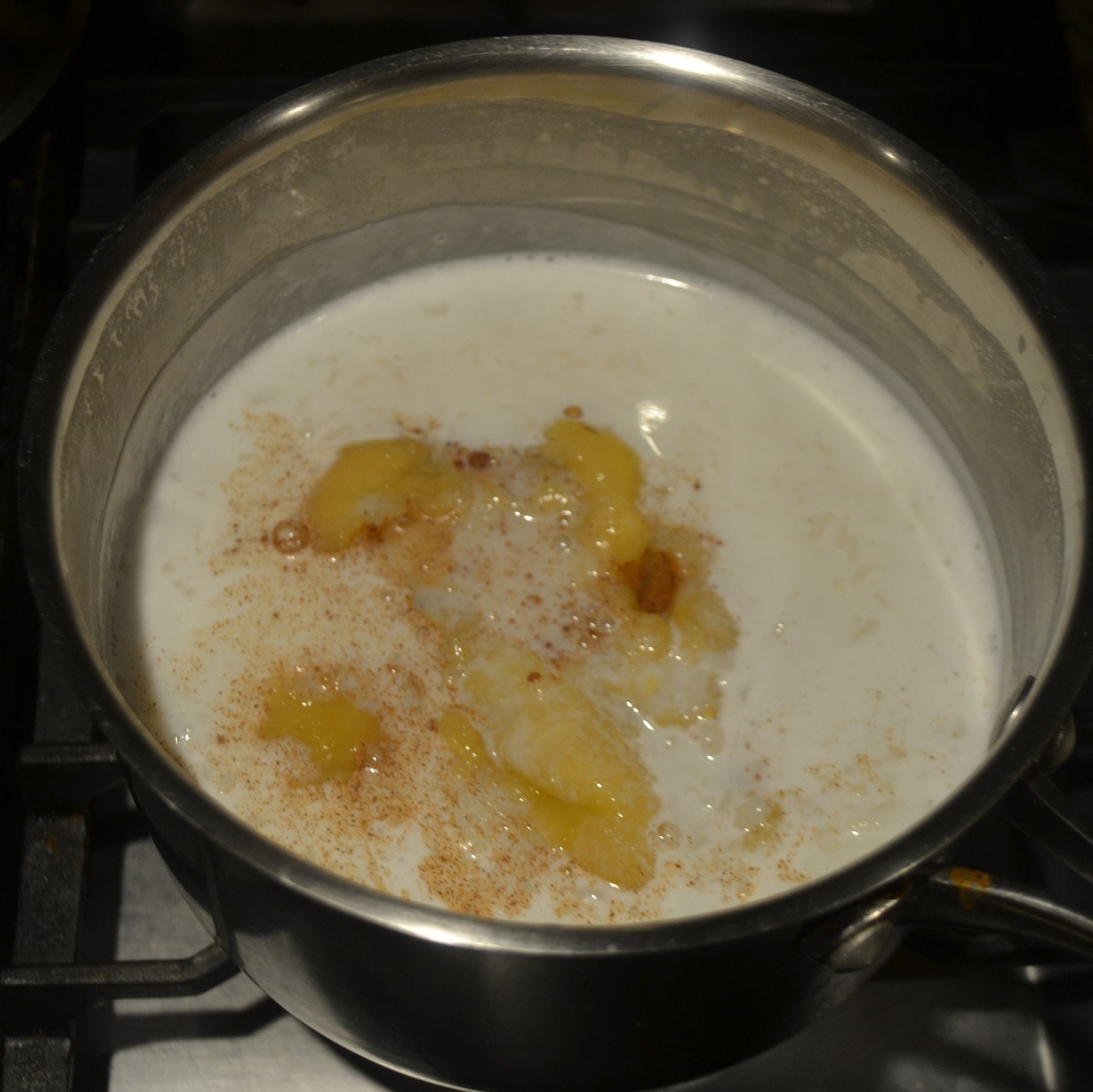 Mashed banana and cinnamon is added to sweetened rice.