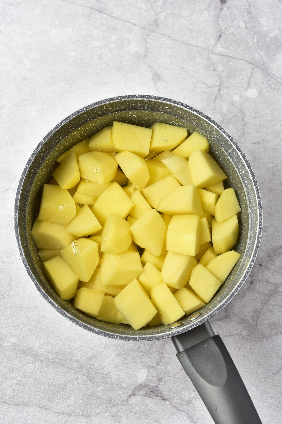 Cubed potatoes in a pot. 