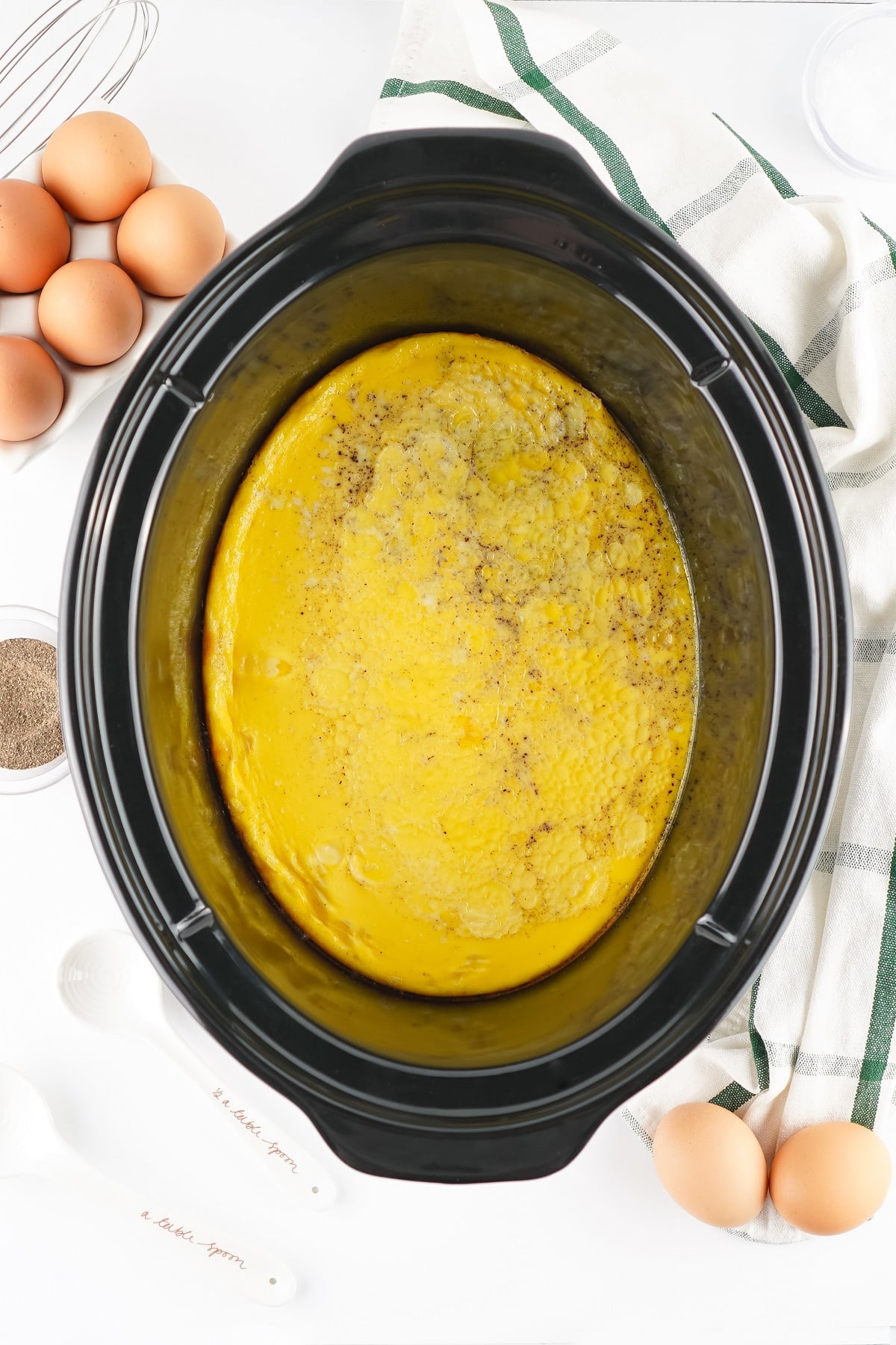 The egg mixture is cooked in the slow cooker. 