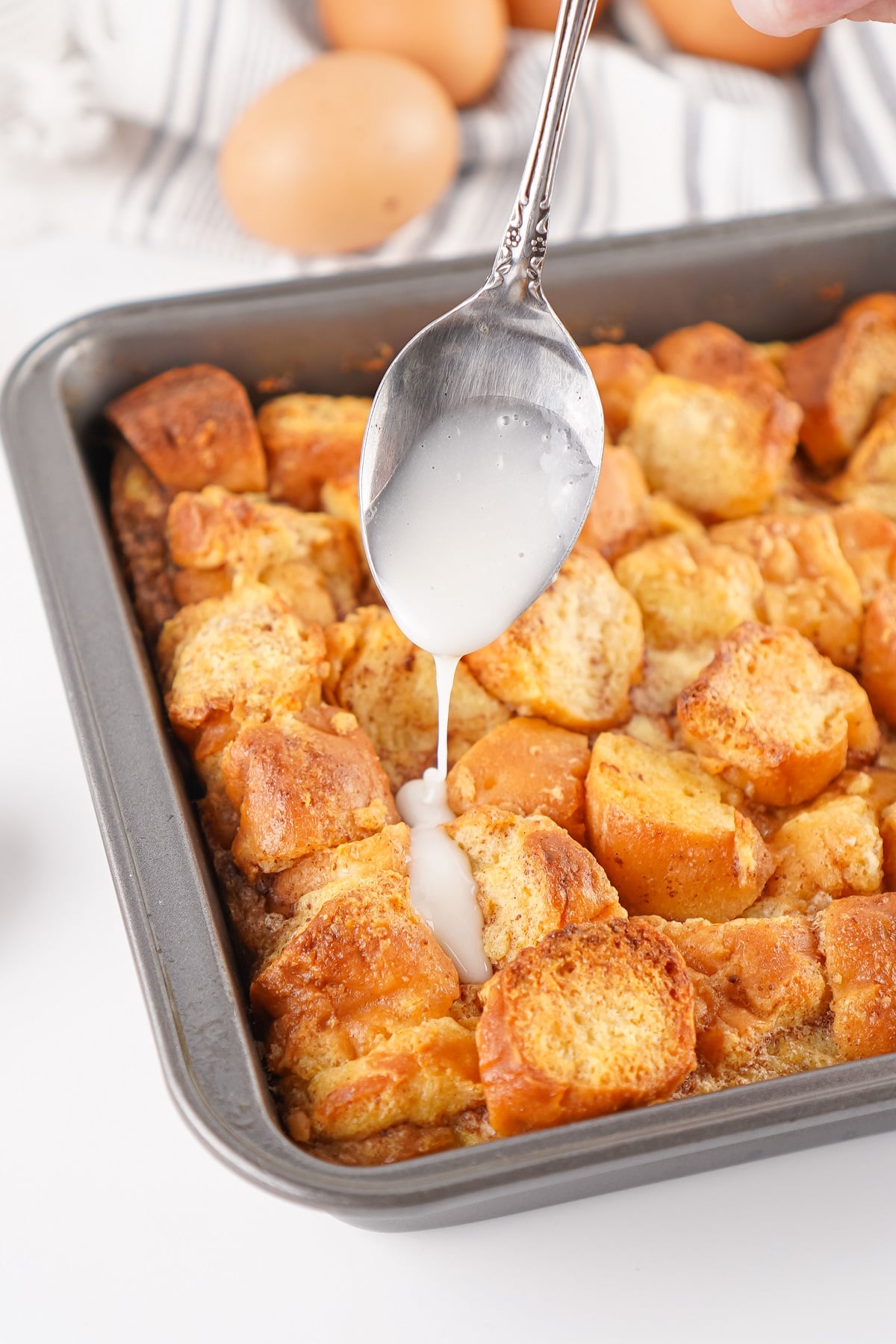 A simple vanilla glaze is drizzled over bread pudding. 