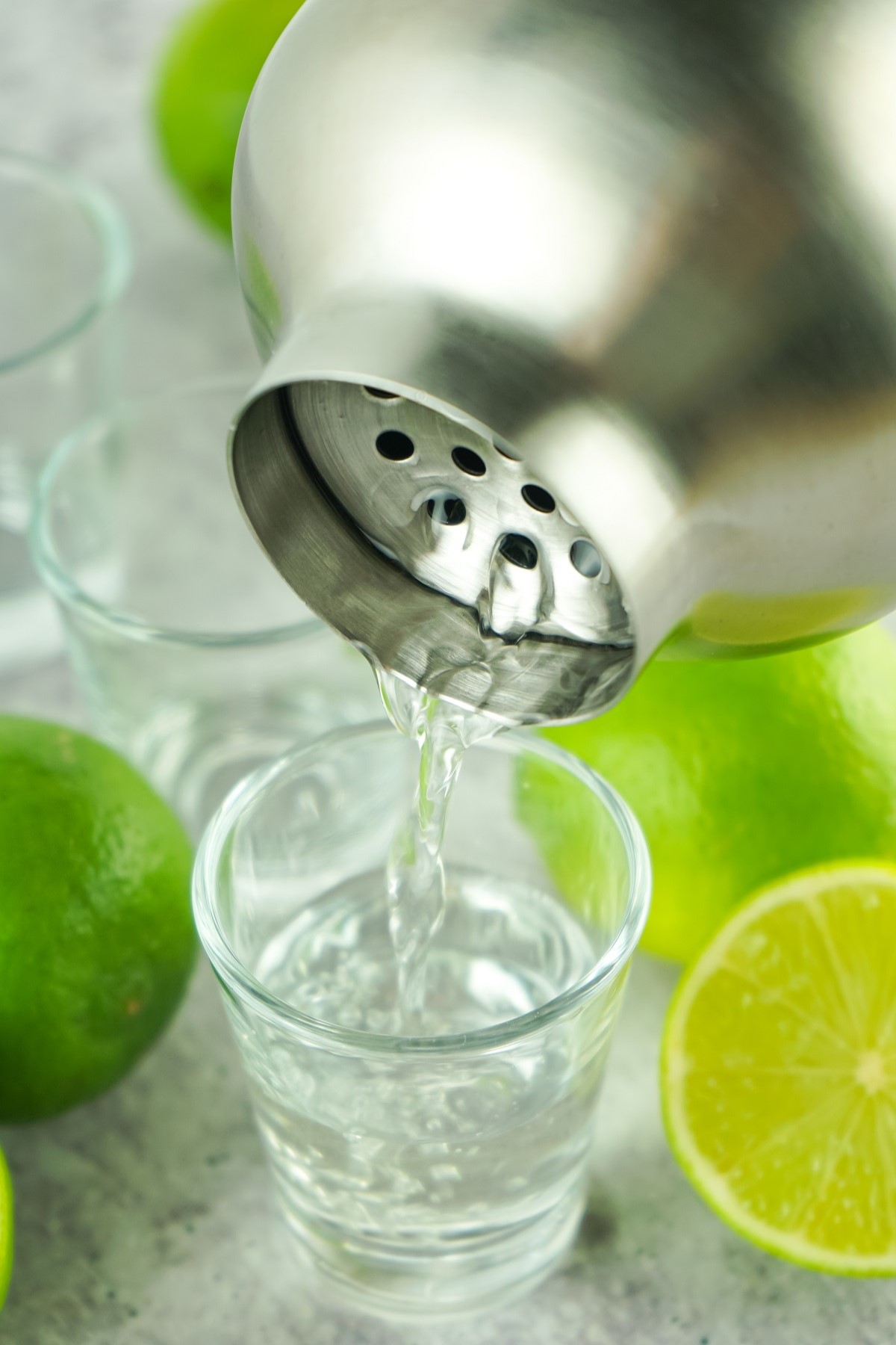 Kamikaze shots are strained into shot glasses. 