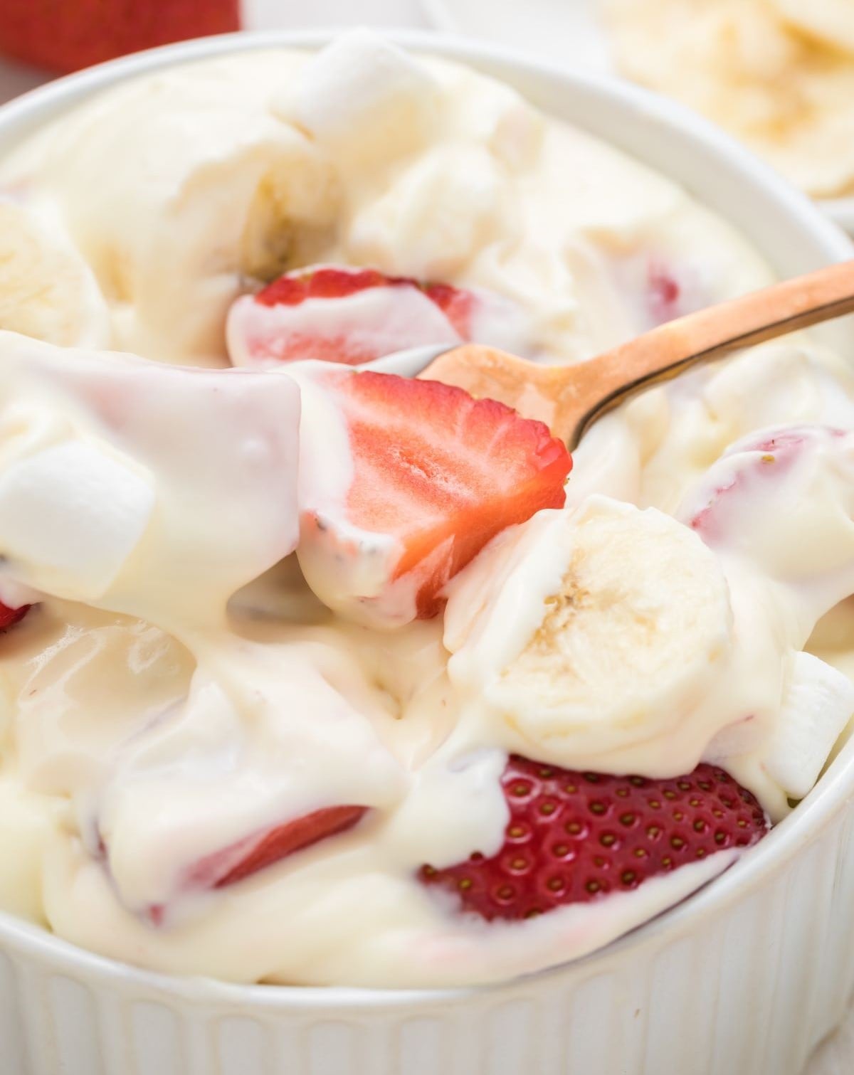 Close up of this creamy fruit salad.