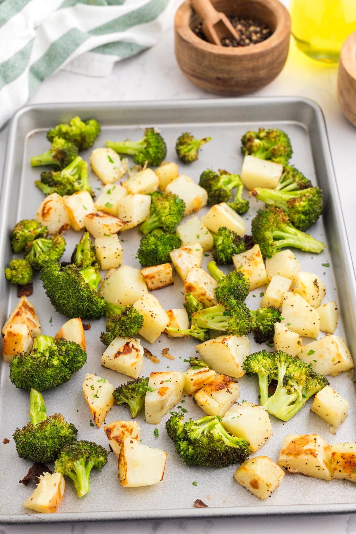 Broccoli and potatoes are roasted until crispy. 