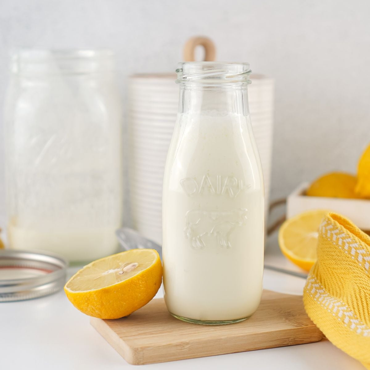Homemade buttermilk in a glass dairy jug.