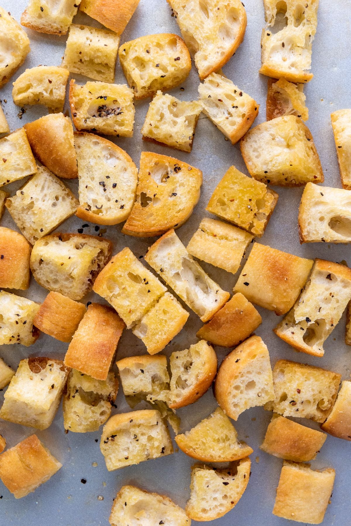 Cubes of lightly toasted ciabatta bread.