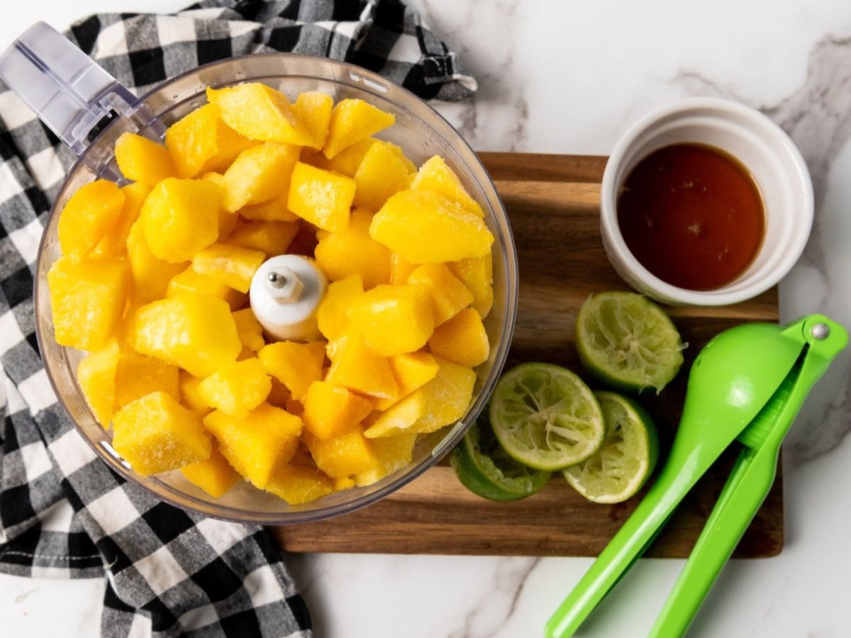 Mango, lime juice and maple syrup are blended until smooth. 